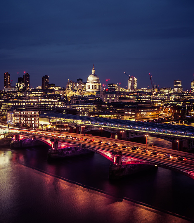 Nighttime aerial shot featuring St. Pauls Cathedral